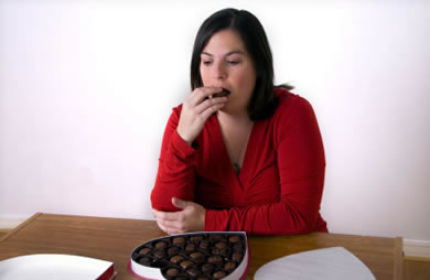 Woman Eating Chocolate